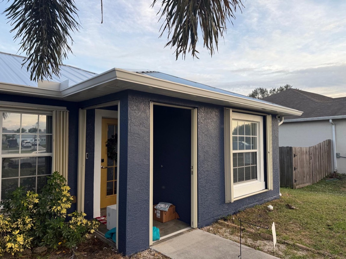 Screened porch and gutters on a Treasure Coast home, Stronghold Gutters service area
